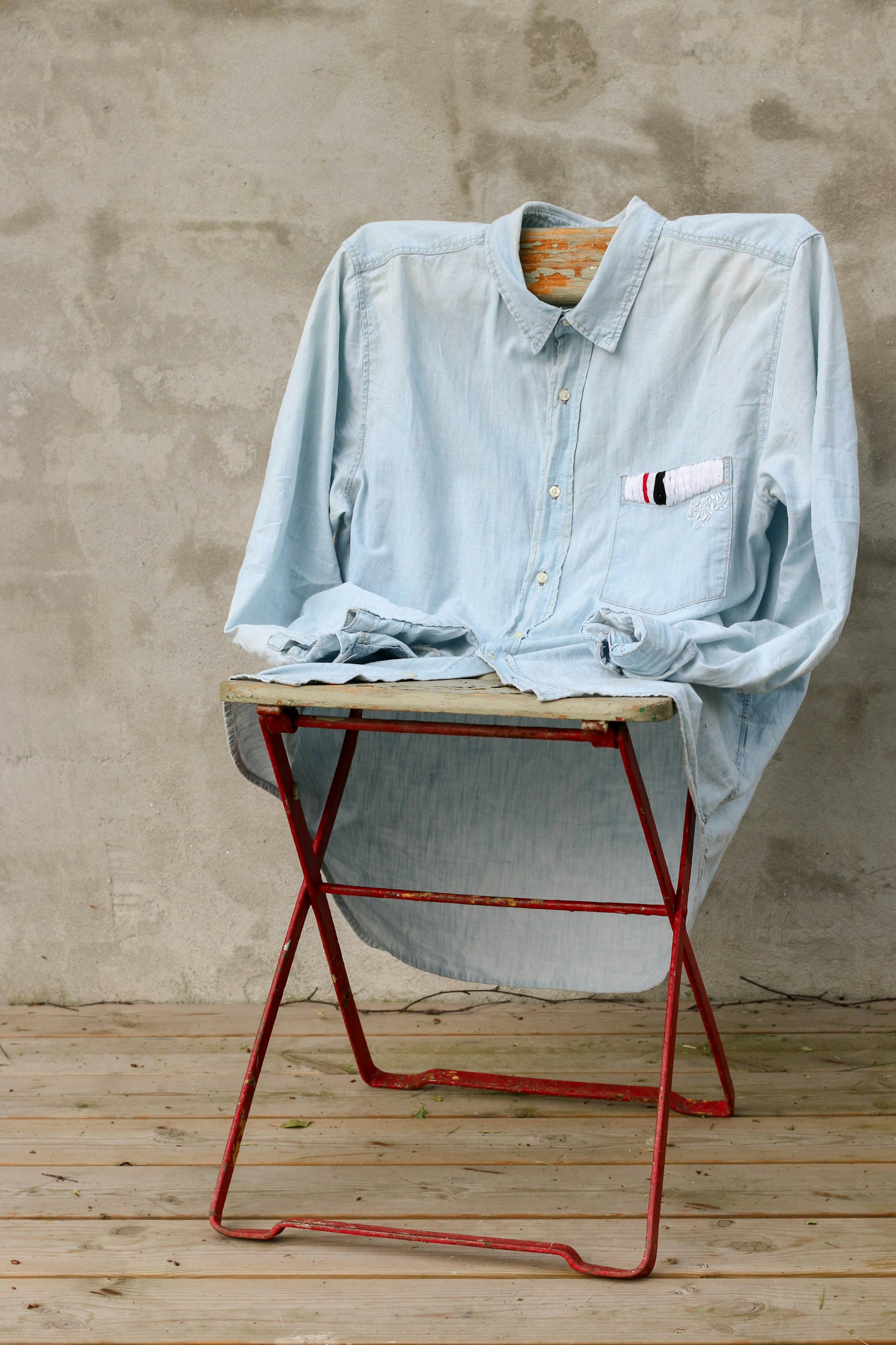 Custom printed garments hanging in the Merlin Creations studio